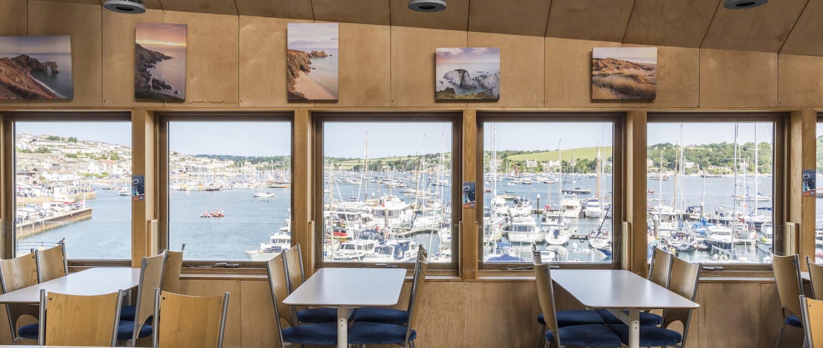 A photo of the Waterside Cafe at the Museum, with the windows overlooking Falmouth Marina and the harbour.