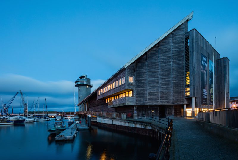 The National Maritime Museum Cornwall at dusk overlooking Falmouth harbour credit Luke Hayes