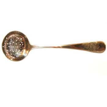A photo of a tea strainer against a white background.