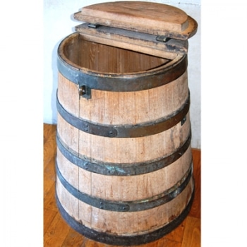A photo of a wooden meat cask with its lid partially open.