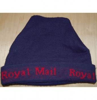 A photo of a navy blue woolly hat with 'Royal Mail' sewn onto the brim with red cotton thread.