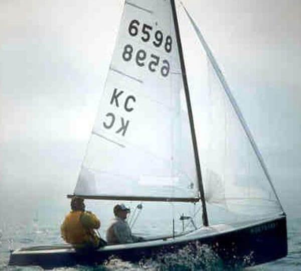 A photo of two people sailing in the 'Plane Jane'.