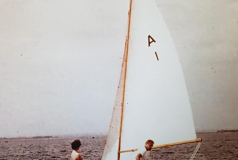 A faded photograph of two men at sea in the 'Brynhild'.