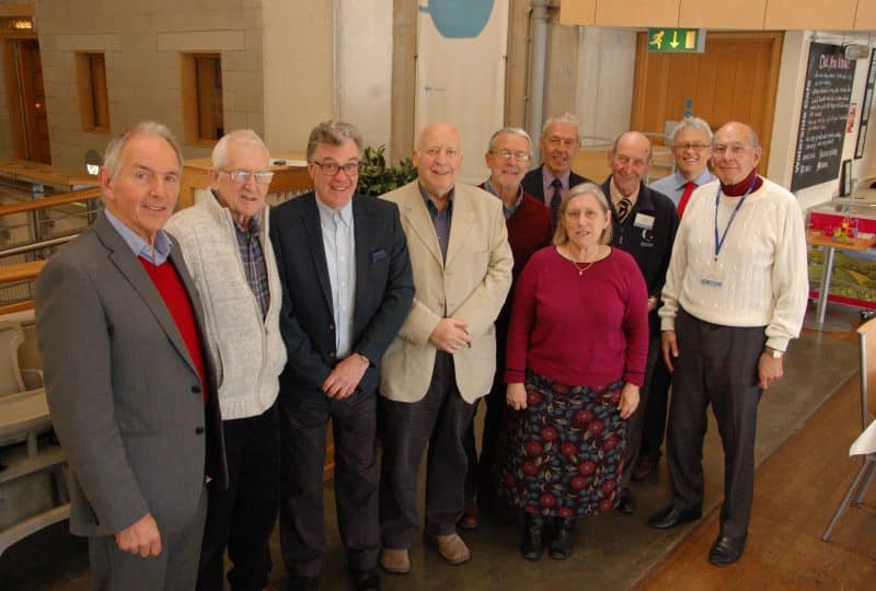 Nine volunteers celebrate reaching five or ten years of voluntary service, pictured with the Museum's director Richard Doughty.