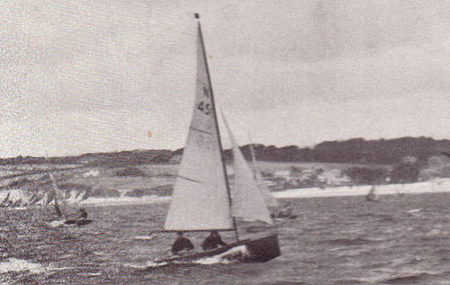 A black and white photo of two people sailing the 'Westwind'.