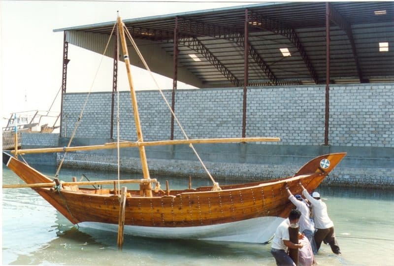 A photo of the 'Tala' being pushed down a slipway into the water.