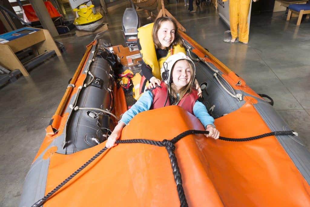 Abi and Tia on the Lifeboat at The National Maritime Museum Cornwall in Falmouth
