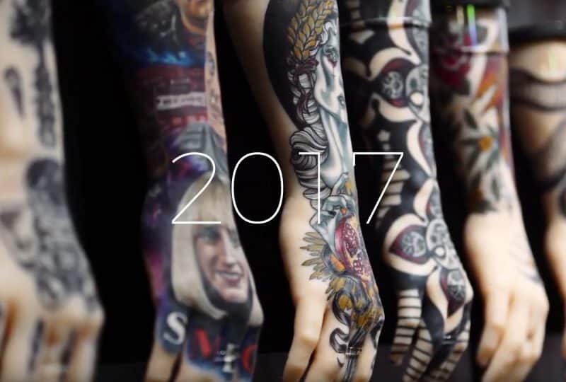 A photo of a row of tattooed silicone hands on display as part of the Museum's 'Tattoo: British Tattoo Art Revealed' exhibition. Text overlaid on top says '2017'.
