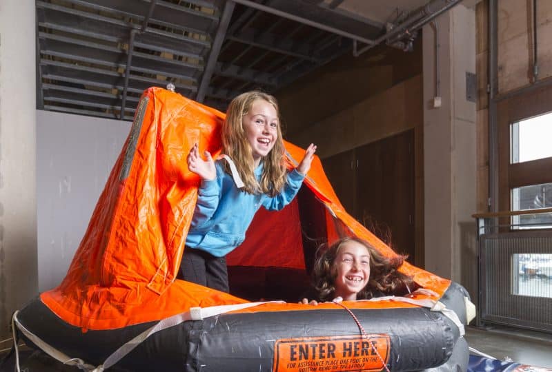 Alfie and Noah on the Liferaft at The National Maritime Museum Cornwall in Falmouth
