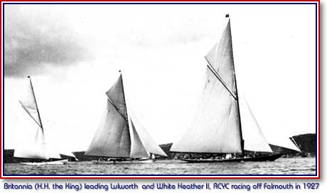Black and white photo of three yachts taking part in a race.