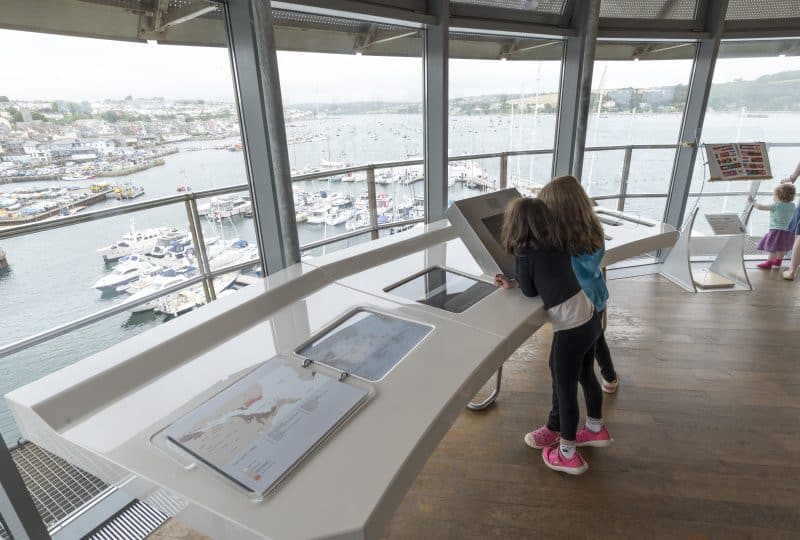 Two young girls look at an information screen in the Museum's Lookout Tower.