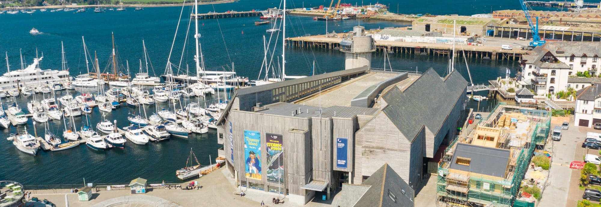 Aerial photo of the Museum with the harbour and docks in the background.