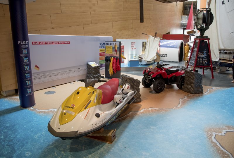 Photo of the Museum's RNLI Rescue Zone, featuring a jet ski, quad bike, and replica lifeguard uniforms for children to try on.