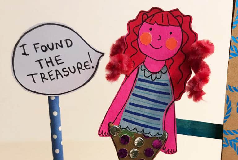 Photo of a mermaid stick puppet with a speech bubble saying 'I found the treasure!'