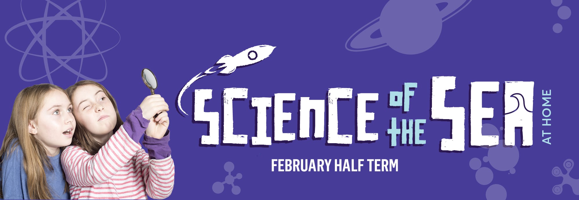 Against a purple background, text on the right reads 'Science of the Sea at Home' and 'February half term'. On the left, two girls peer through a magnifying glass.