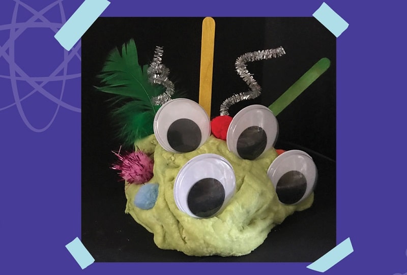 Photo of 'alien slime' made as part of a Make & Take session, made from slime, googly eyes, pipe cleaners and pom poms.