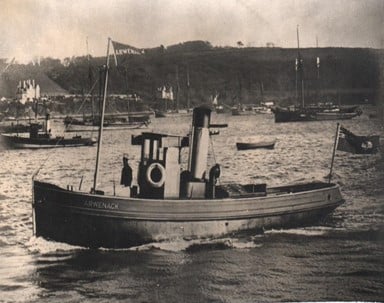 Black and white photo of the the Commissioners’ launch 'Arwenack' sailing across Falmouth harbour.