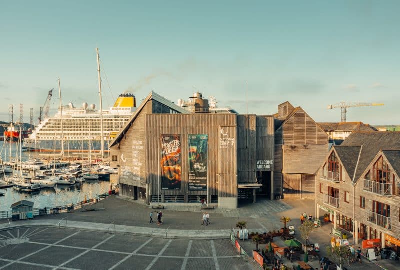 External photo of the Museum, with Falmouth Docks and a partially-obscured cruise ship in the background.