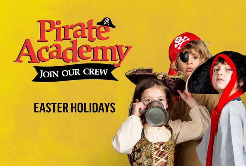 The left side of the image features text that reads 'Pirate Academy', 'join our crew' and 'Easter holidays'. The right side of the image has three children - two boys and one girl - dressed in pirate costumes.
