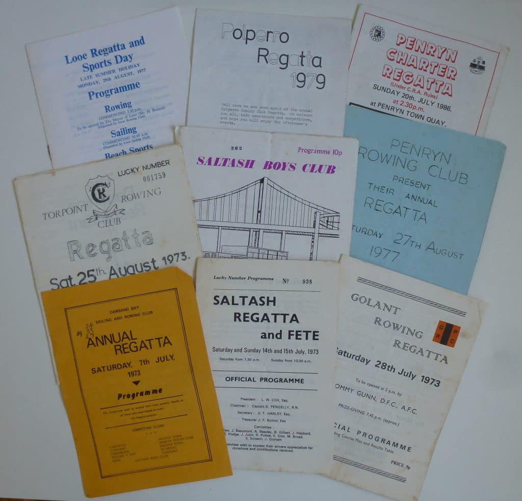 A colour photo of a number of programmes from rowing regattas.