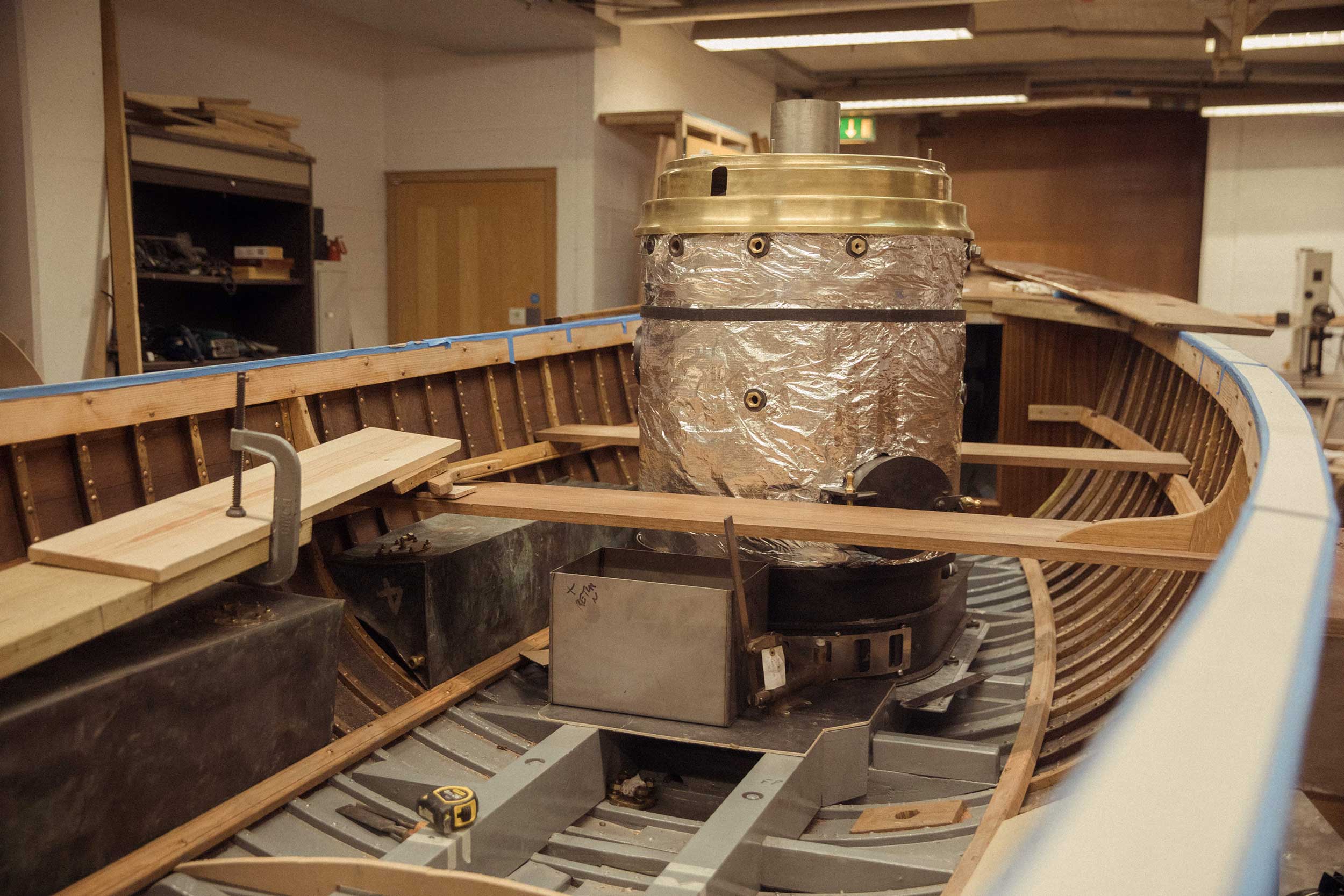 Photo of the steam launch 'Emma' undergoing work in the Museum's workshop.