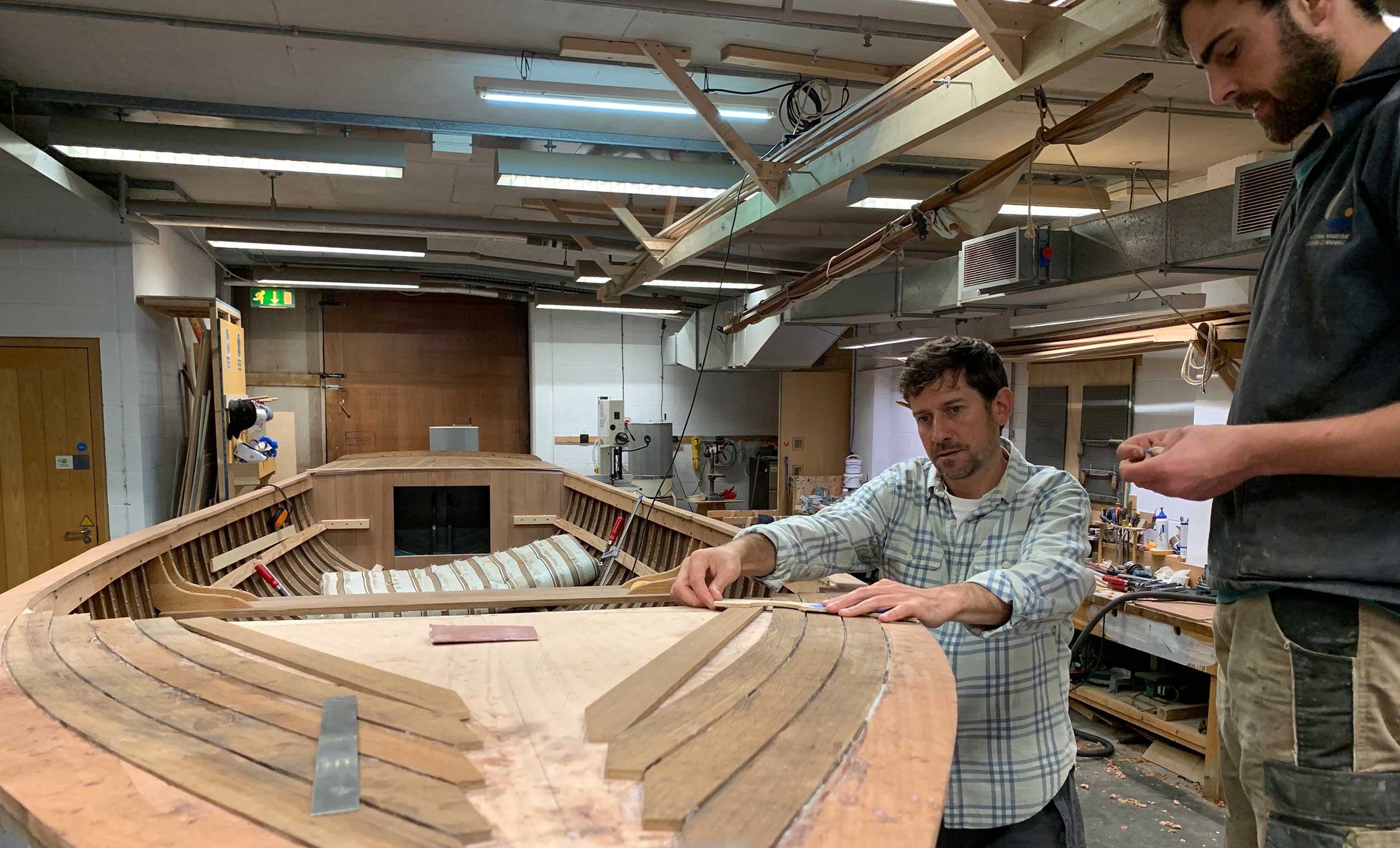 Photo of work being carried out on the steam launch 'Emma' in the Museum's workshop.