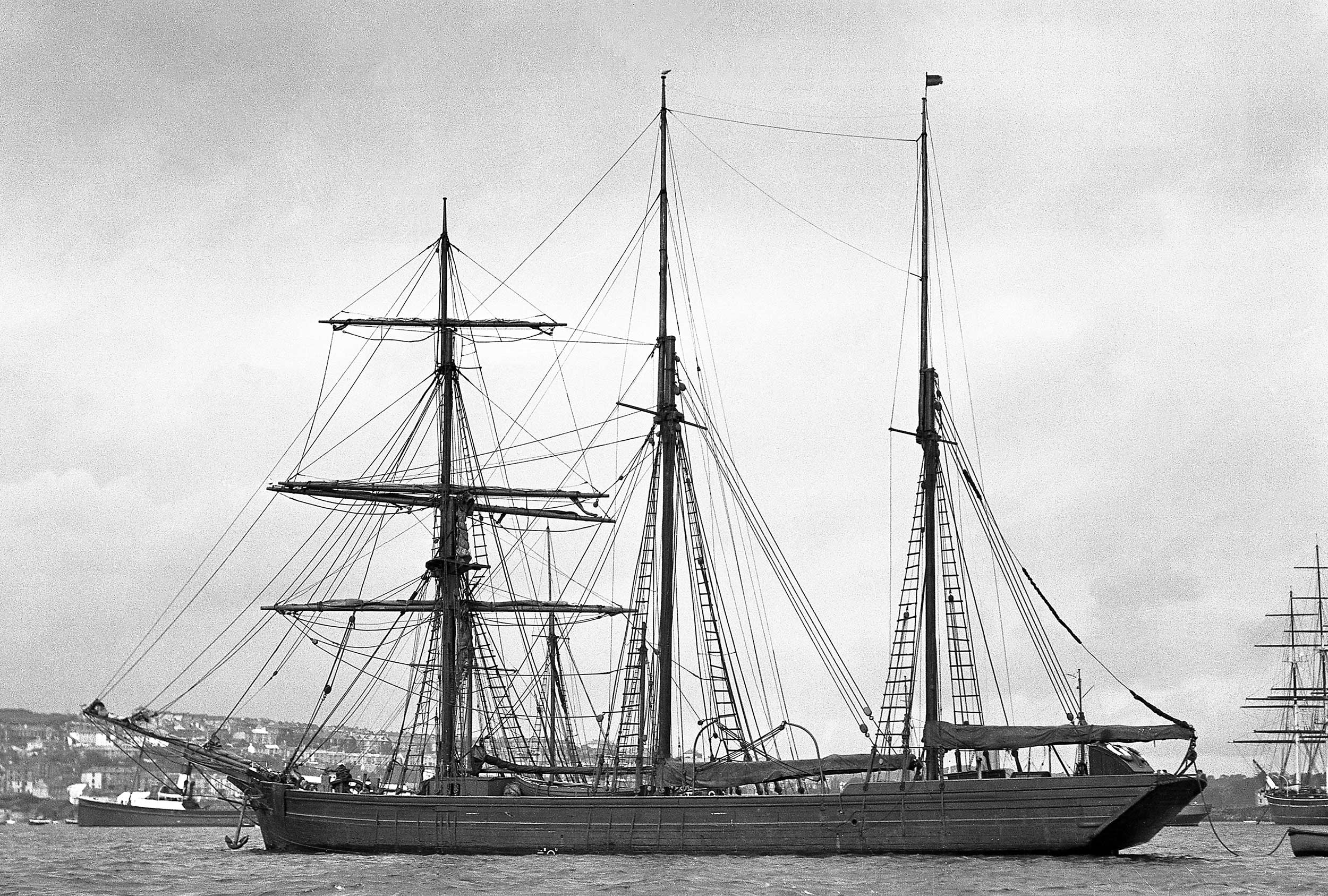 Black and white photo of the barquentine 'Waterwitch' in Falmouth harbour.