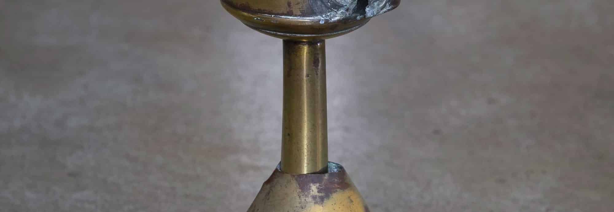 Photo of a pilchard oil lamp.