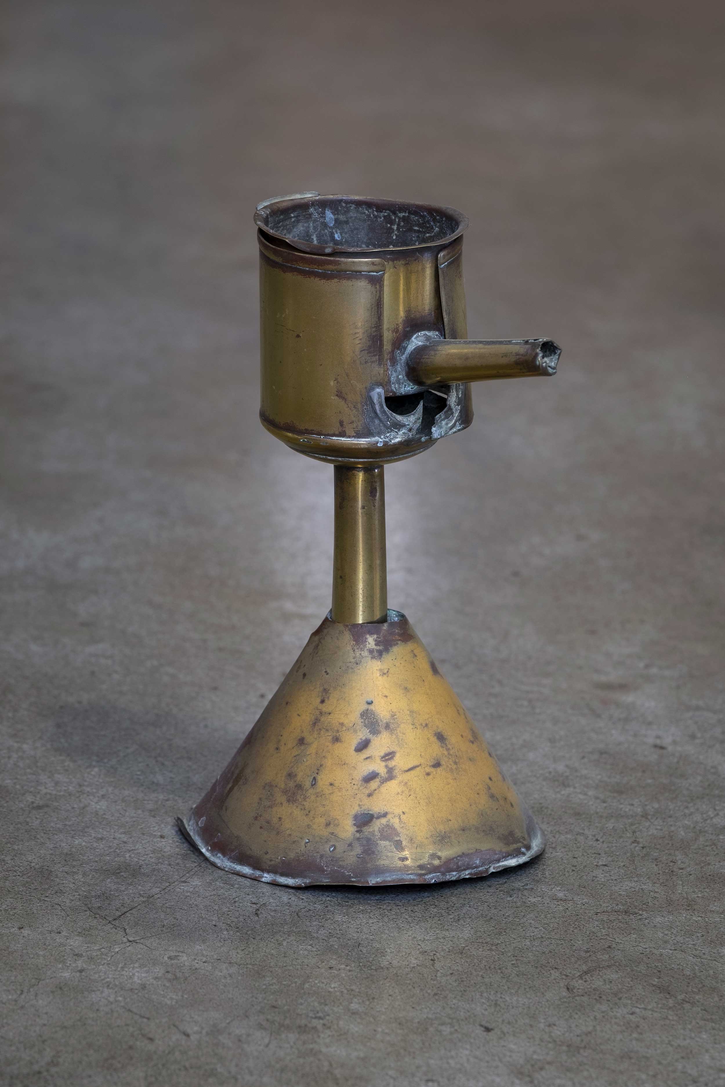 Photo of a pilchard oil lamp.