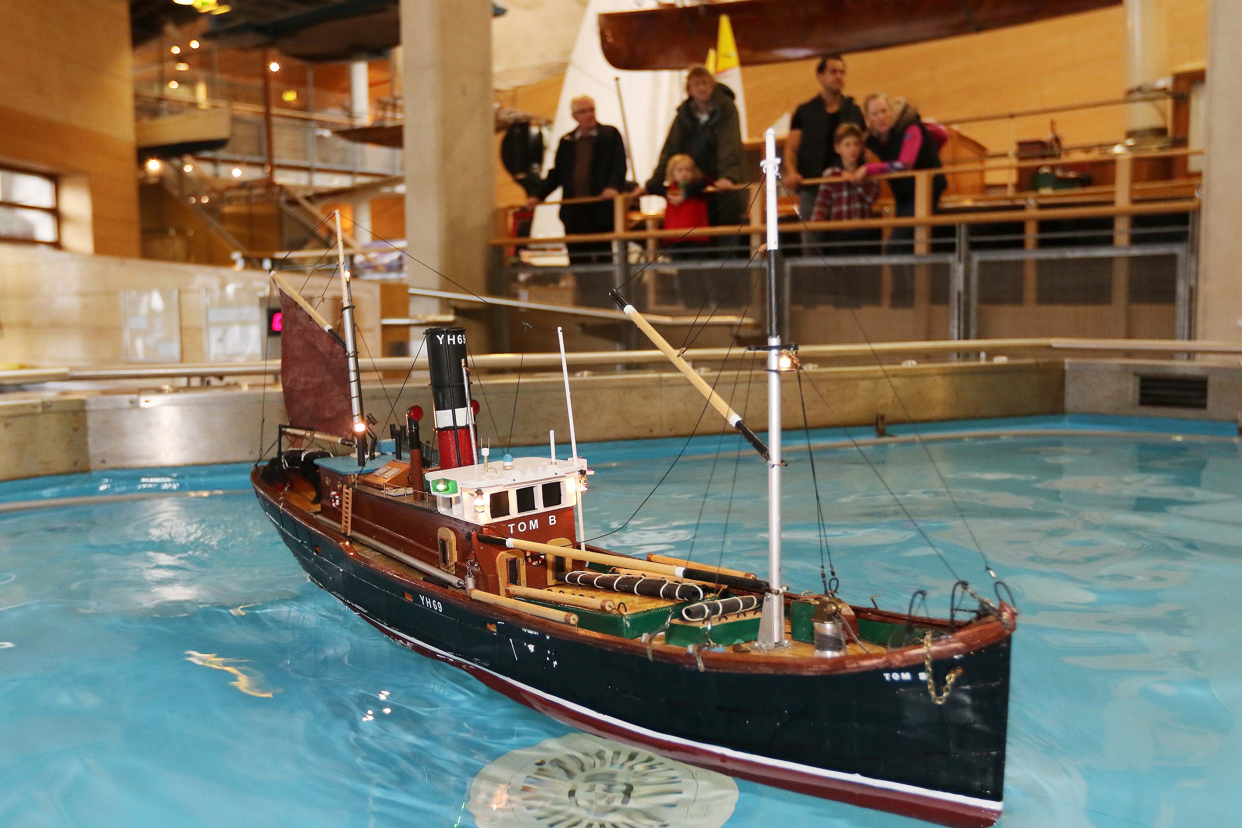 A model boat floats on the Museum's Boat Pool.
