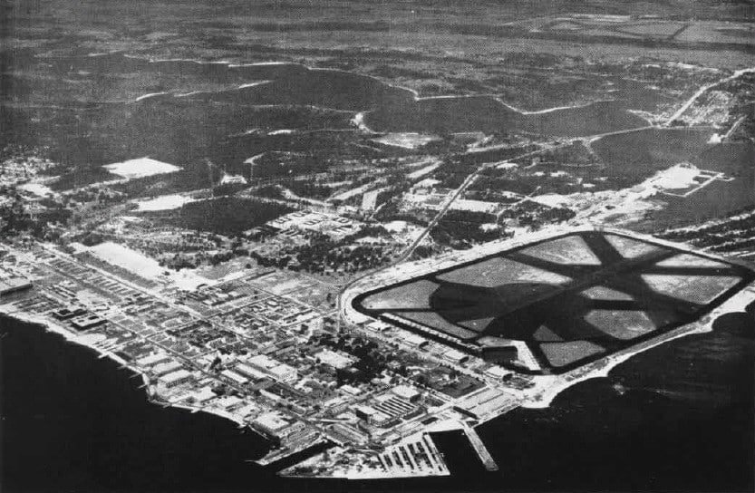 A black and white photo of an Aerial View of the Naval Air Station Pensacola with the Airfield known as Chevalier Field in 1947.