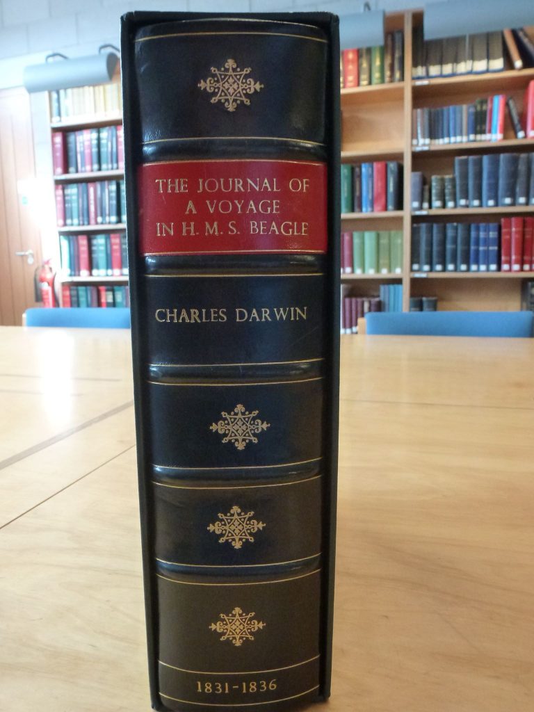 Facsimile copy of ‘The Journal of a Voyage in HMS Beagle, Charles Darwin, 1831-1836’ held at the Bartlett Maritime Research Centre and Library. photo of the spine of the journal.