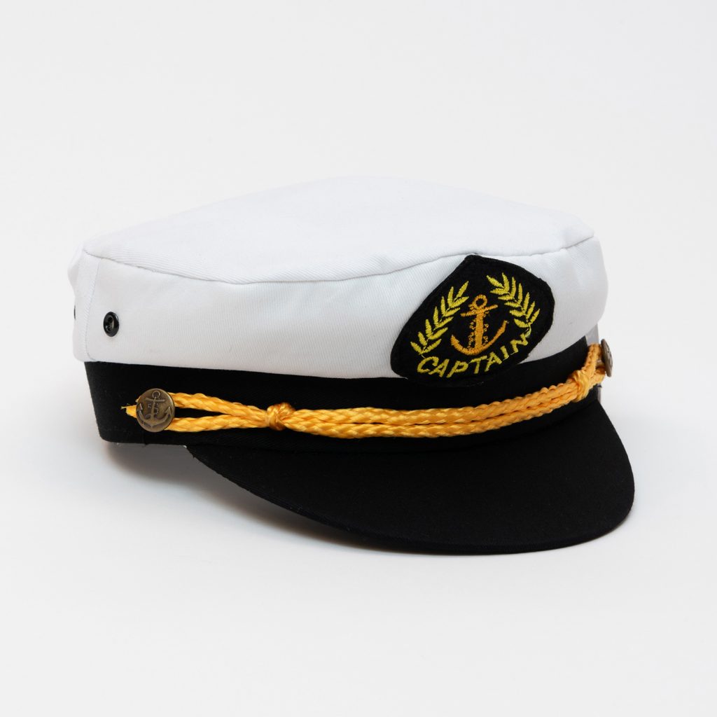 A black and white children's captain hat with yellow braiding. Pictured on a white background.