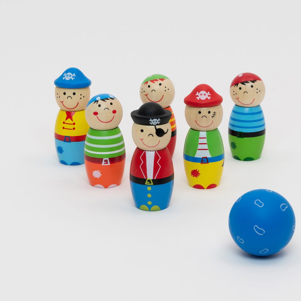 A set of brightly coloured wooden pirate skittles and a blue ball. Pictured on a white background.