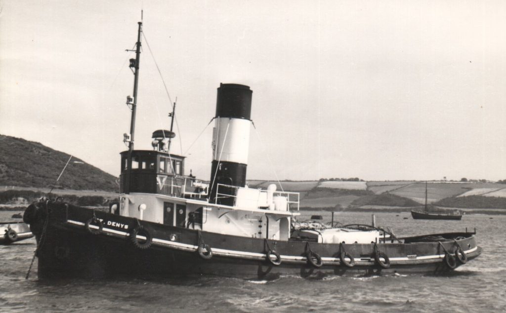 A black and white photo of the steam tug St Denys moored in Falmouth Harbour.