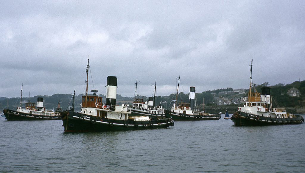 A photo of five of the Falmouth steam tugs at anchor in Falmouth Harbour, taken in 1964.