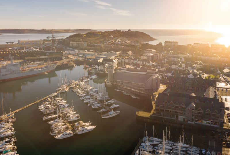 An aerial shot of National Maritime Museum Cornwall at sunrise.