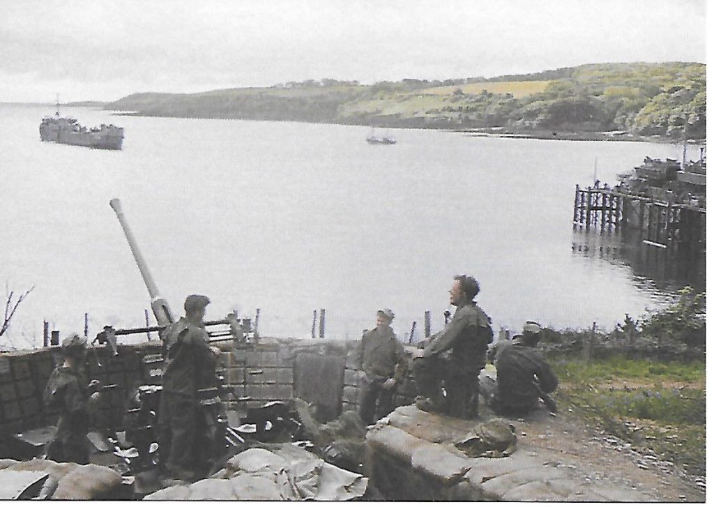A Trebah Gardens postcard of a photograph of the armament at Trebah Beach, colourised.