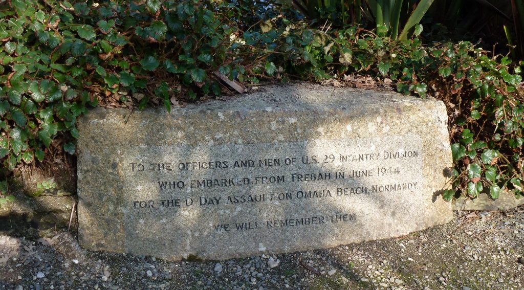 Memorial at Trebah Beach. It reads: To the Officers and Men of the 29th Infantry Division who embarked from Trebah in June 1944 for the D-Day assault on Omaha Beach, Normandy We will remember them.