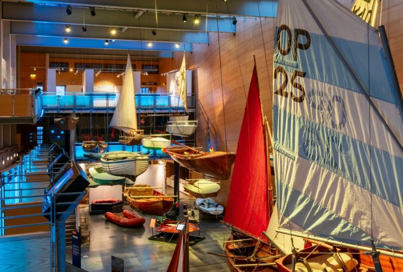 The Flying Flotilla at National Maritime Museum Cornwall. Boats hang from the ceiling in the Boat Hall.