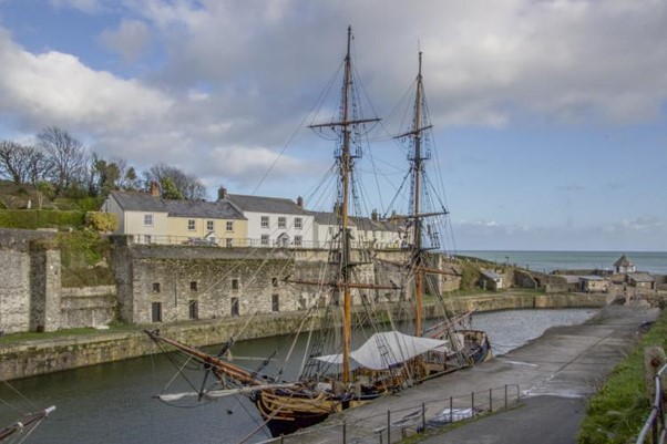 A photo of Charlestown Harbour with a historic ship moored at the quay