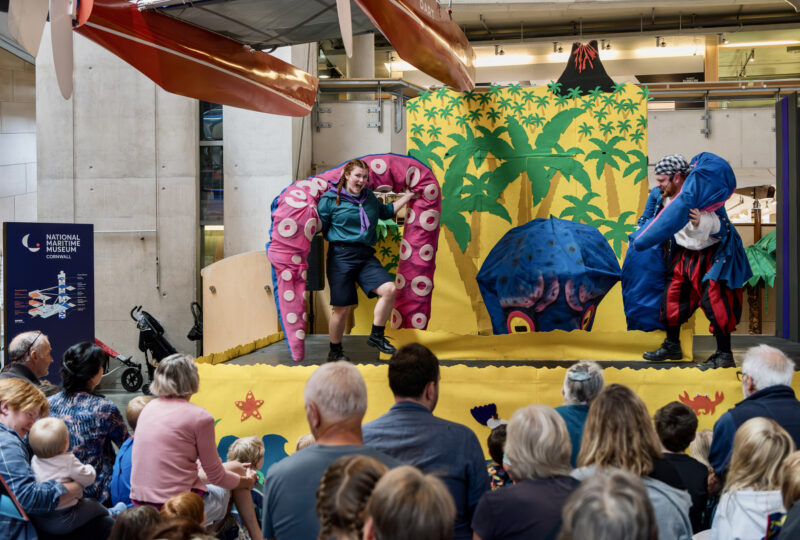 Two actors on stage at Escape from Treasure Island at National Maritime Museum Cornwall.