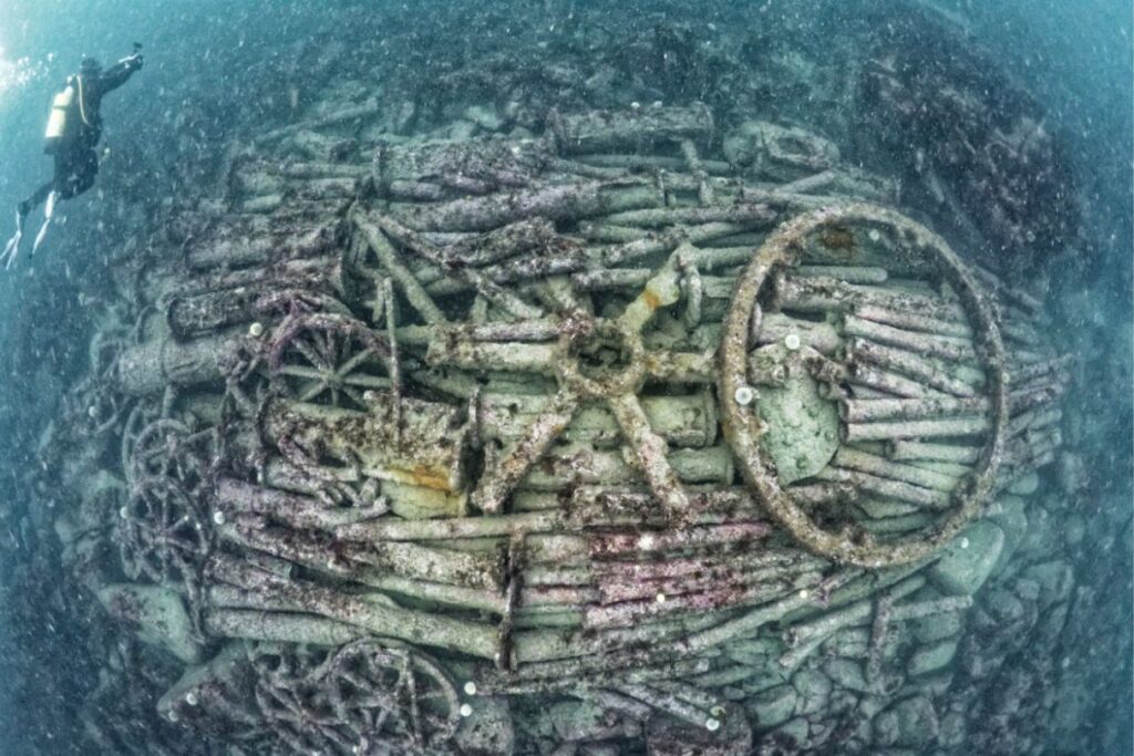 A diver exploring a shipwreck.