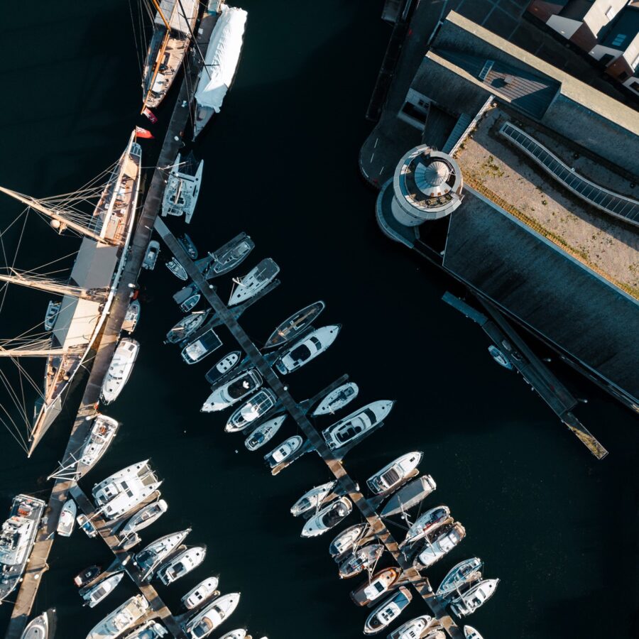 A bird's eye view looking top-down on NMMC and boats in Falmouth Harbour.