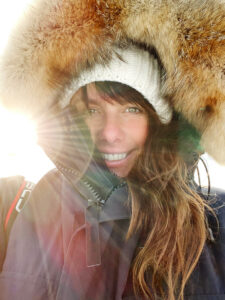 Portrait Photograph of Lucia Griggi wearing a coat with a big fluffy hood