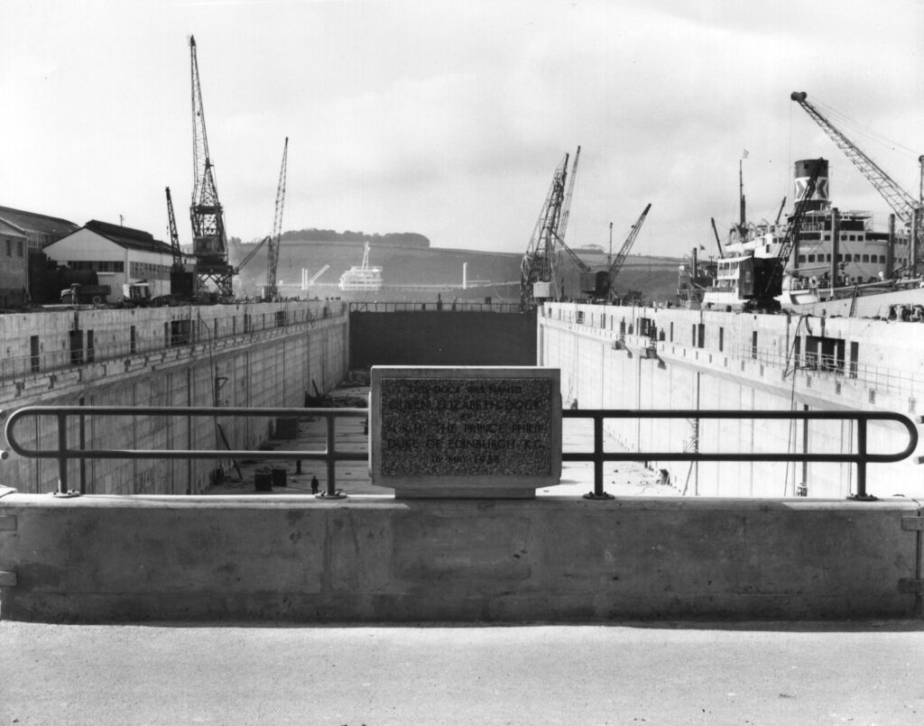 A black and white photograph of the commemorative plaque at the head of the dry dock.