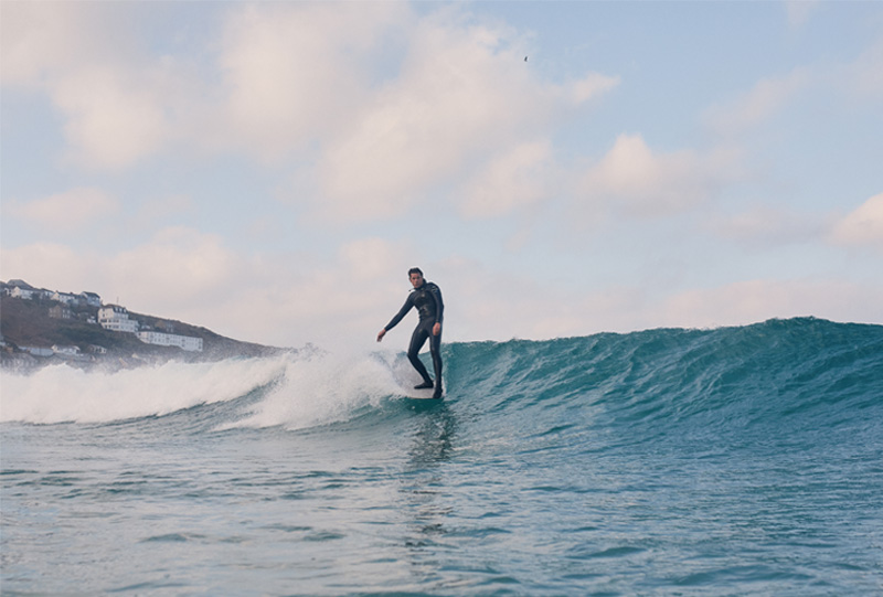 Surfer Sam Bleakley catching a wave