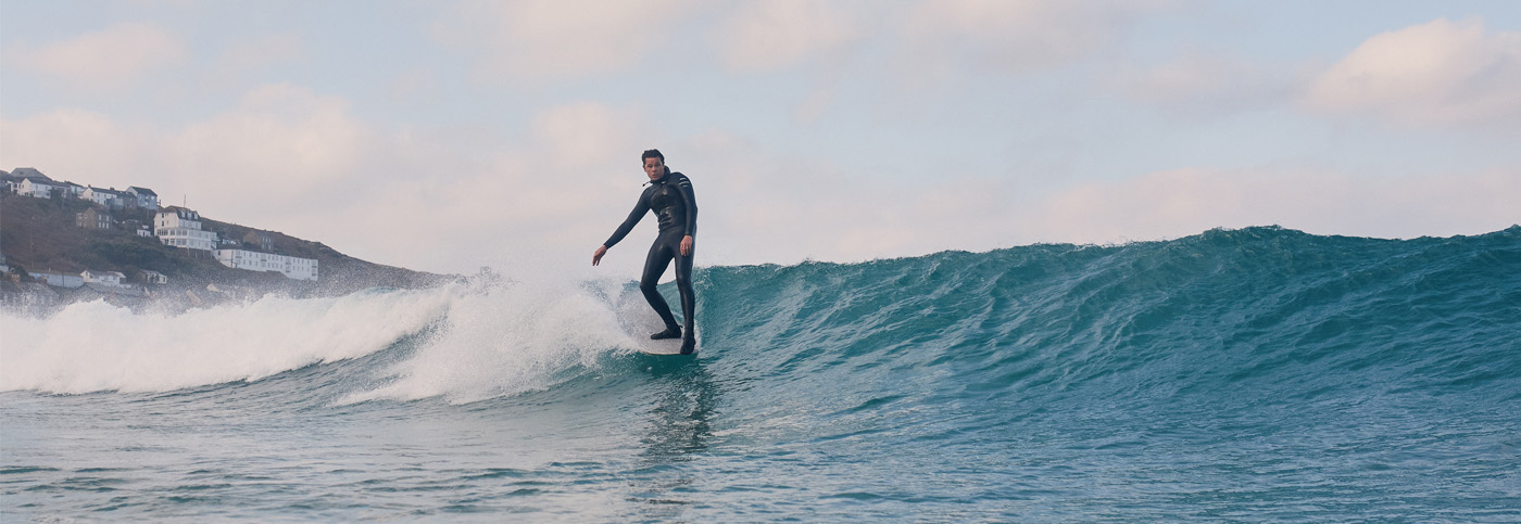 Surfer Sam Bleakley catching a wave