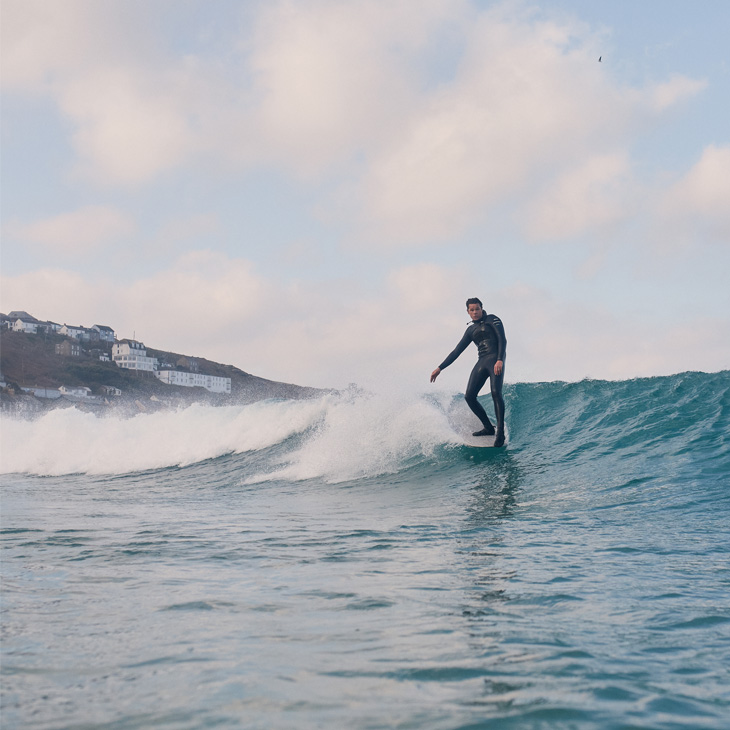 Surfer Sam Bleakley catching a wave