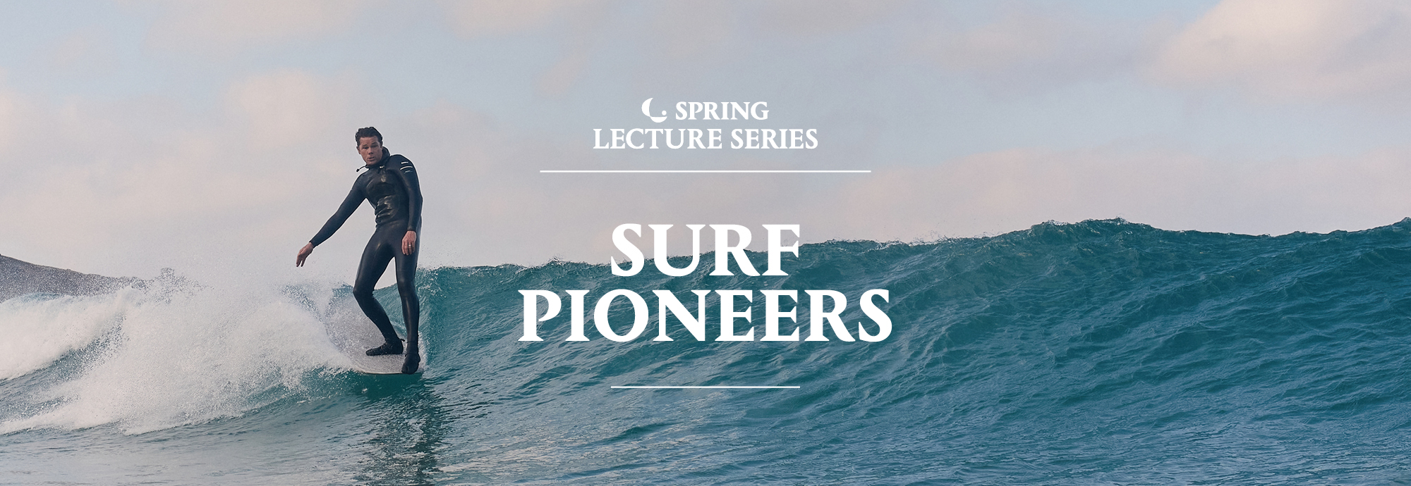 A photograph shows a man wearing a black wetsuit surfing a wave, in the middle of the image the text reads 'spring lecture series - Surf Pioneers' with a logo.